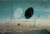 John Tunnard, Abstraction at Noon (c.1941) Painting by John Tunnard of imaginary abstract objects - one white and one black oval suspended in a framework and devised to exist in a 3-D space with a brown landscape beneath it and a blue background.