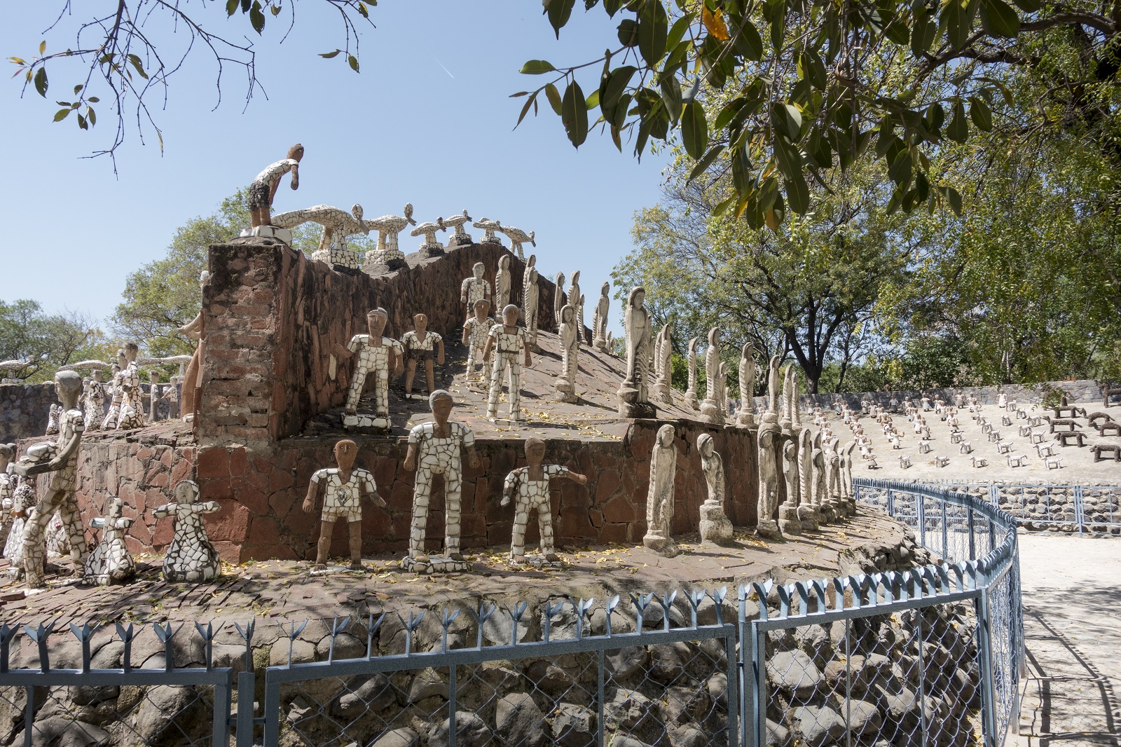 Nek Chand, The Rock Garden of Chandigarh Rows of sculptures of human figures made out of discarded pottery