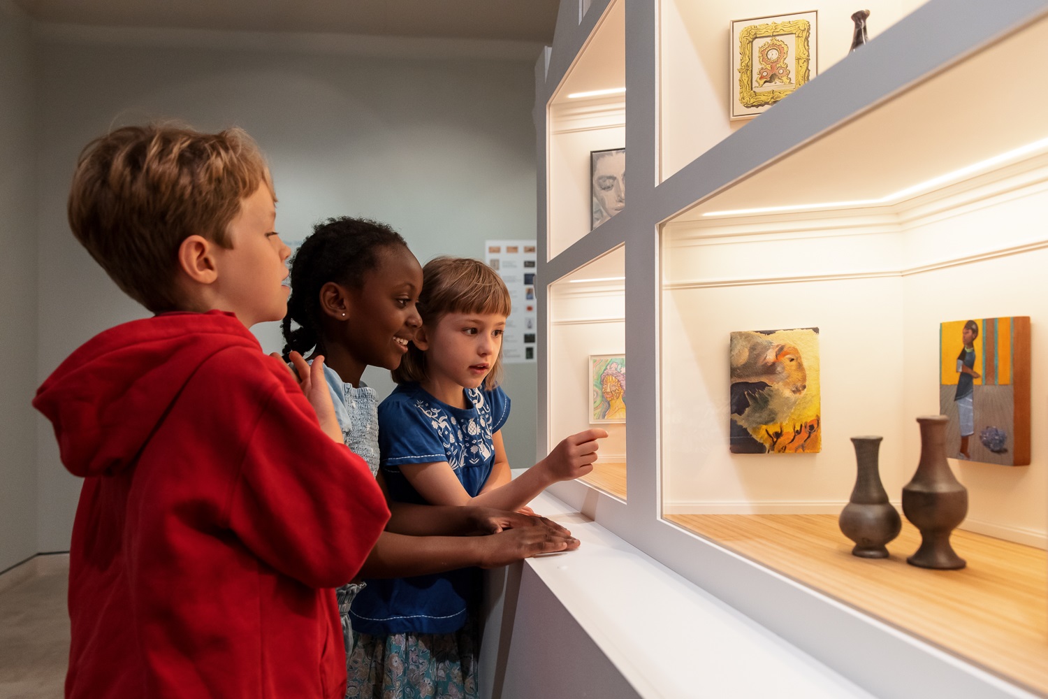 Children looking at model art gallery
